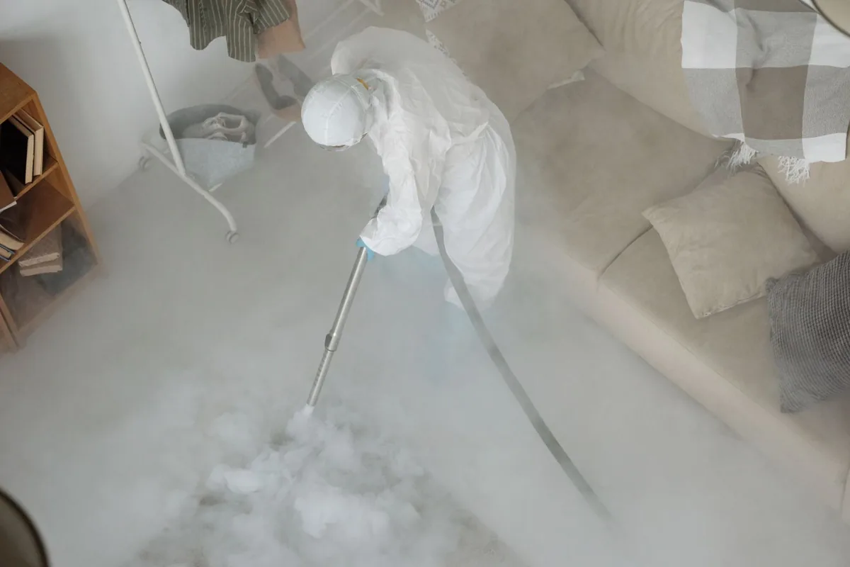 Biohazard cleanup technician in protective equipment, Watergate, FL